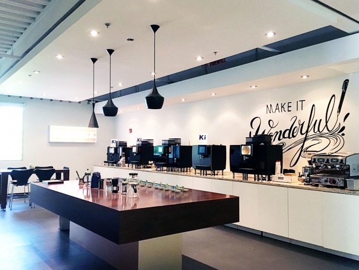 Showroom Interior featuring wall graphics, demo table